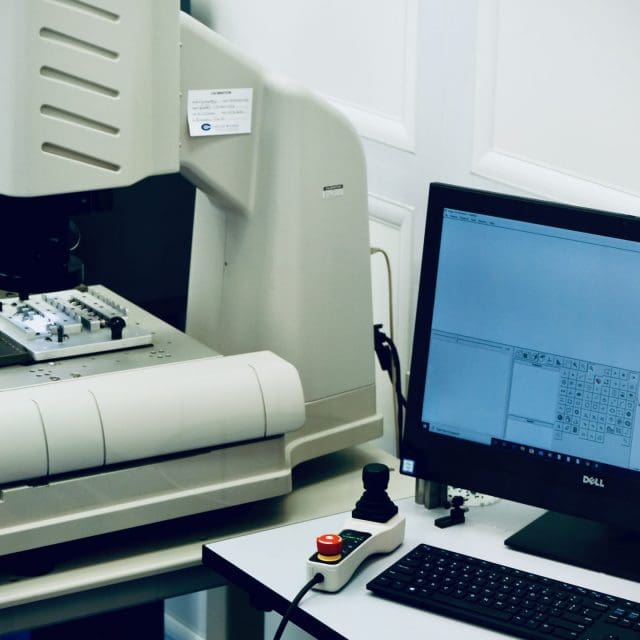 Mikrotech-Facilities-Quality-Lab-scaled-640x640 A computer and printer on top of a desk.